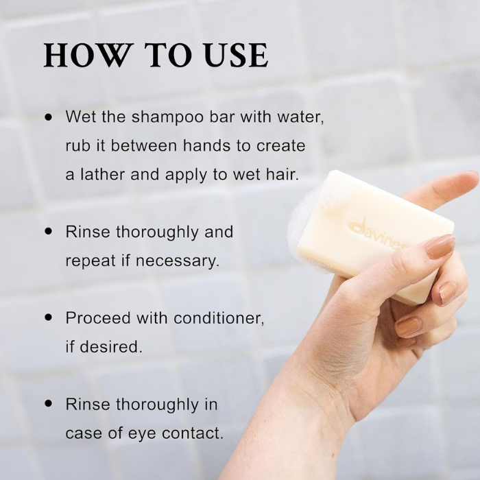 Davines shampoo bar in use on wet hair