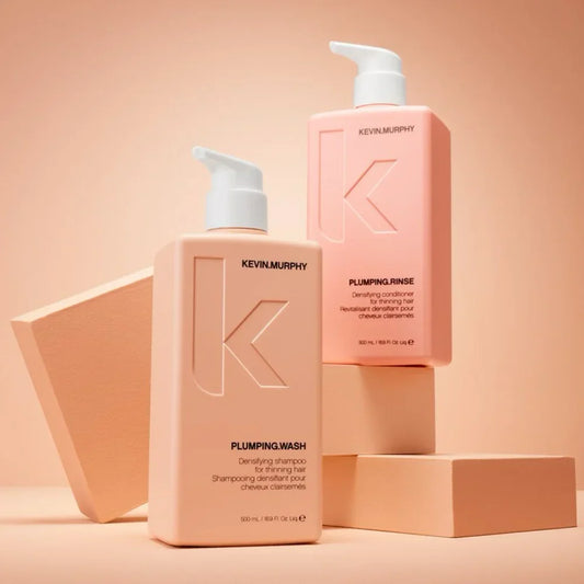 KEVIN.MURPHY PLUMPING.WASH and PLUMPING.RINSE 500ml bottles on peach blocks