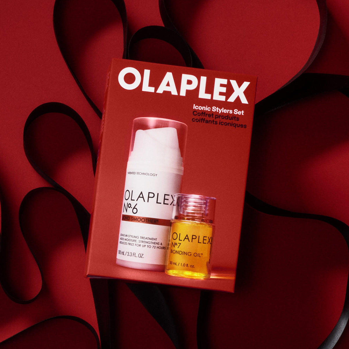 OLAPLEX Iconic Stylers limited-edition holiday gift set on red background