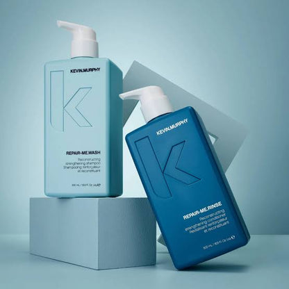 KEVIN.MURPHY REPAIR-ME.WASH and REPAIR-ME.RINSE 500ml bottles on blue blocks